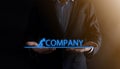 Businessman holding a concept in his hands.The silhouette of man pushes the word COMPANY.business economy concept Royalty Free Stock Photo