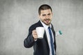 Businessman holding a cup of coffee