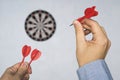 Businessman holding a dart aiming at the target - business targeting, aiming, focus concept. hit the target. Success in business Royalty Free Stock Photo