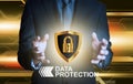 Businessman holding data protection shield