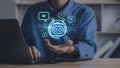Businessman holding digital chatbot for provide access to information and data in online network.Artificial intelligence