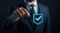 Businessman Holding Digital Shield Symbolizing Security and Trust Royalty Free Stock Photo