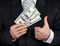 Businessman holding dollar banknotes Royalty Free Stock Photo