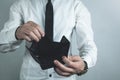 Businessman holding empty black leather wallet. Royalty Free Stock Photo