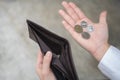 Businessman holding an empty wallet. He was facing a stressful crisis. He is waiting for a new job, recession situation, Royalty Free Stock Photo