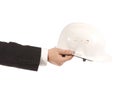 Businessman holding an engineer helmet