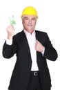 Businessman holding a 100 euro note Royalty Free Stock Photo