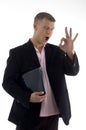 Businessman holding files and showing ok sign Royalty Free Stock Photo