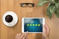 Businessman holding five star rating,Review, increase rating or