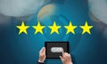 Businessman holding five star rating,Review, increase rating or