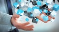 Businessman holding floating blue shiny cube network 3D rendering Royalty Free Stock Photo