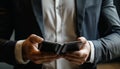 Businessman holding a foldable smartphone, technology concept.