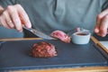 Businessman holding fork and knife eating steak, business and food.restaurant concept.eating stake from plate with fork Royalty Free Stock Photo