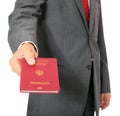 Businessman holding german passport Royalty Free Stock Photo