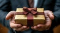 Businessman holding gift box in hands elegant presentation Royalty Free Stock Photo