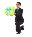 Businessman holding a gift box and kneel down .