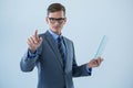 Businessman holding a glass sheet and touching an invisible screen