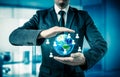 Businessman holding globe in his hands. The concept of personnel management around the world Royalty Free Stock Photo