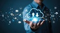 Businessman holding a glowing cloud icon with upload and download arrows, symbolizing cloud computing and data transfer Royalty Free Stock Photo