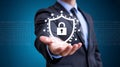 Businessman holding a glowing digital shield with a padlock symbol representing cybersecurity and data protection Royalty Free Stock Photo