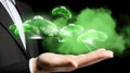 Businessman holding glowing green cloud representing eco cloud computing Royalty Free Stock Photo
