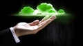 Businessman holding glowing green cloud representing eco cloud computing Royalty Free Stock Photo