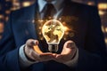 Businessman holding a glowing light bulb with world map in his hands, Businessman hand holding light bulb with graph and chart on Royalty Free Stock Photo