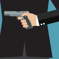 Businessman holding a gun behind his back Royalty Free Stock Photo