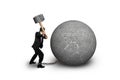 Businessman holding hammer hitting cracked concrete ball isolate