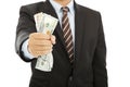 Businessman holding a handful of us dollars Royalty Free Stock Photo