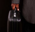 Businessman holding his briefcase Royalty Free Stock Photo