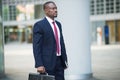 Businessman holding his briefcase Royalty Free Stock Photo