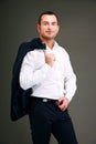 Businessman holding his jacket over shoulder Royalty Free Stock Photo