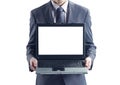 Businessman holding his laptop Royalty Free Stock Photo