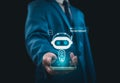 Businessman holding hologram digital chatbot, robot application, conversation assistant, AI Artificial Intelligence concept, Royalty Free Stock Photo