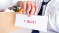 Businessman holding with I quit words card letter, resign employee Change of job concept