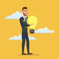 Businessman holding the idea of holding a lamp Business cartoon