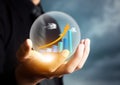 Businessman holding increasing graph in crystal ball Royalty Free Stock Photo