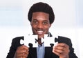 Businessman Holding Jigsaw Puzzle Royalty Free Stock Photo