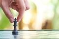 Businessman holding a King Chess is placed on a chessboard. using as background business concept and Strategy concept with copy sp Royalty Free Stock Photo