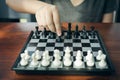 Businessman holding a King Chess is placed on a chessboard.using as background business concept and Strategy concept with copy Royalty Free Stock Photo