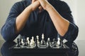 Businessman holding a King Chess is placed on a chessboard.using as background business concept and Strategy concept with copy Royalty Free Stock Photo