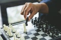 Businessman holding a King Chess is placed on a chessboard.using as background business concept and Strategy concept with copy Royalty Free Stock Photo