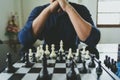 Businessman holding a King Chess is placed on a chessboard.using as background business concept and Strategy concept with copy Royalty Free Stock Photo