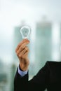 Businessman holding light bulb. Brain creative thinking ideas and innovation concept Royalty Free Stock Photo
