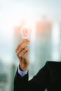 Businessman holding light bulb. Brain creative thinking ideas and innovation concept Royalty Free Stock Photo