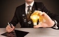 Businessman holding a light bulb, social media concept Royalty Free Stock Photo