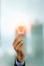 Businessman holding light bulb. Brain creative thinking ideas and innovation concept Royalty Free Stock Photo