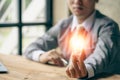 Businessman holding a light bulb, new idea, cutting-edge technology and creativity to save energy Royalty Free Stock Photo