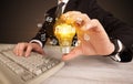 Businessman holding a light bulb, social media concept Royalty Free Stock Photo